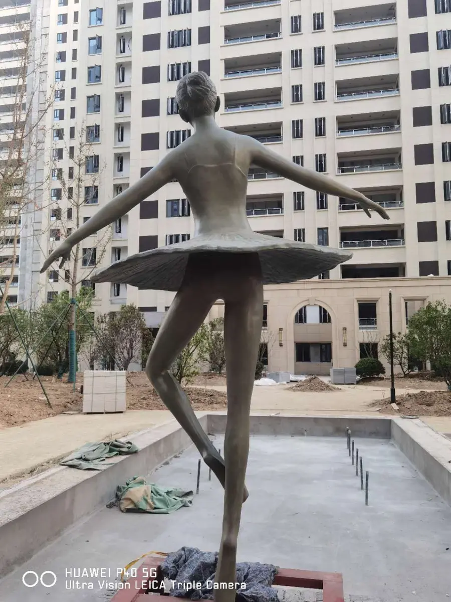 Ballet dancer sculpture during installation