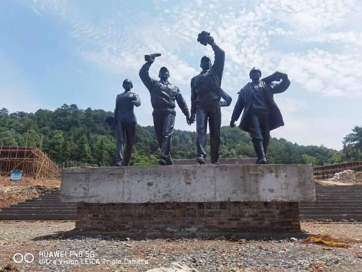 Bronze ensemble of four figures on a plinth