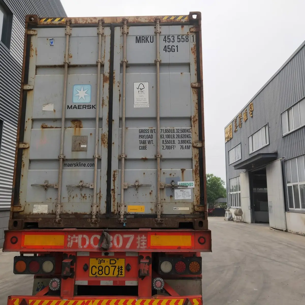 Maersk shipping container being loaded with sculptures for export