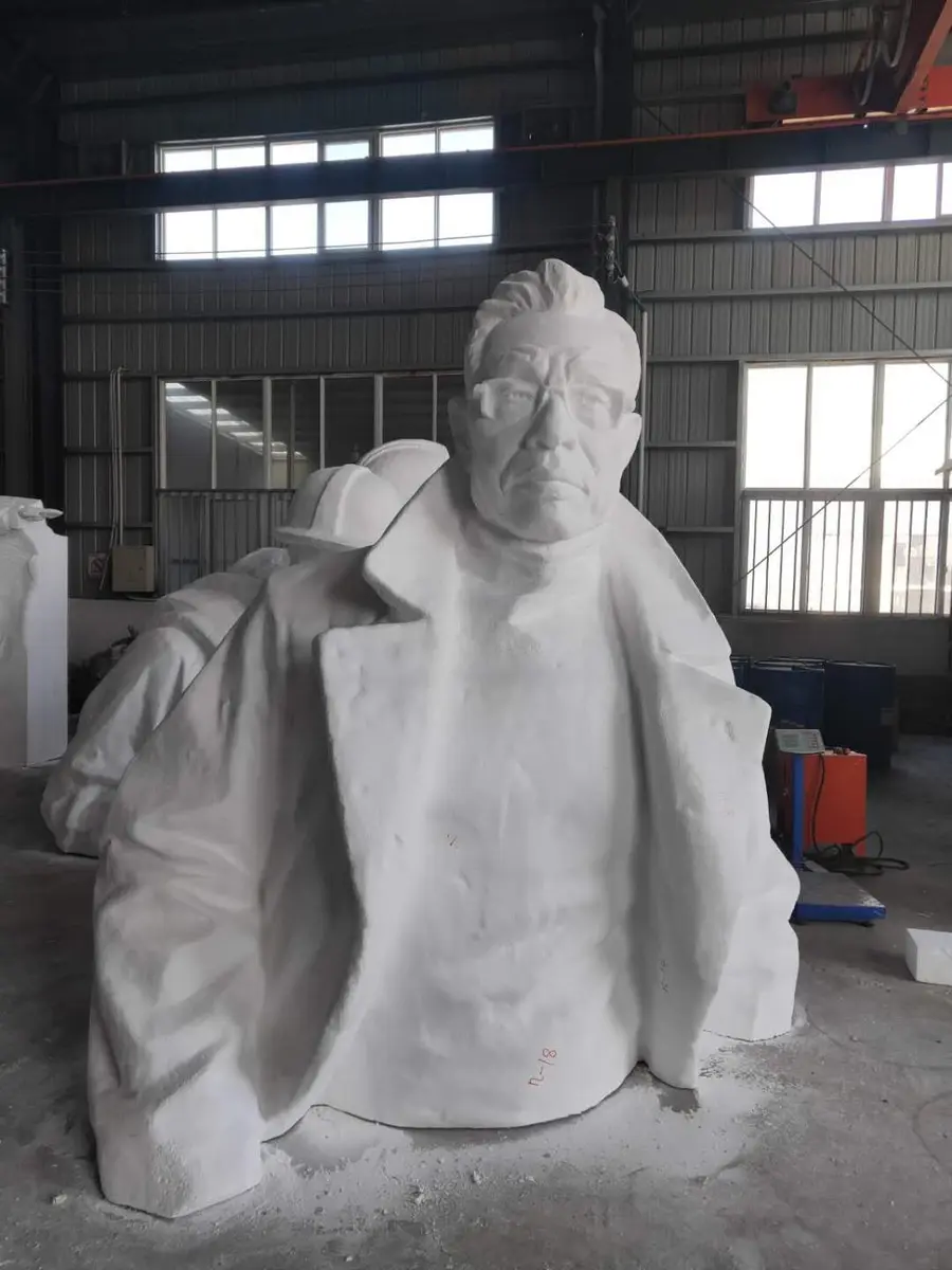White portrait bust with glasses in the casting shop