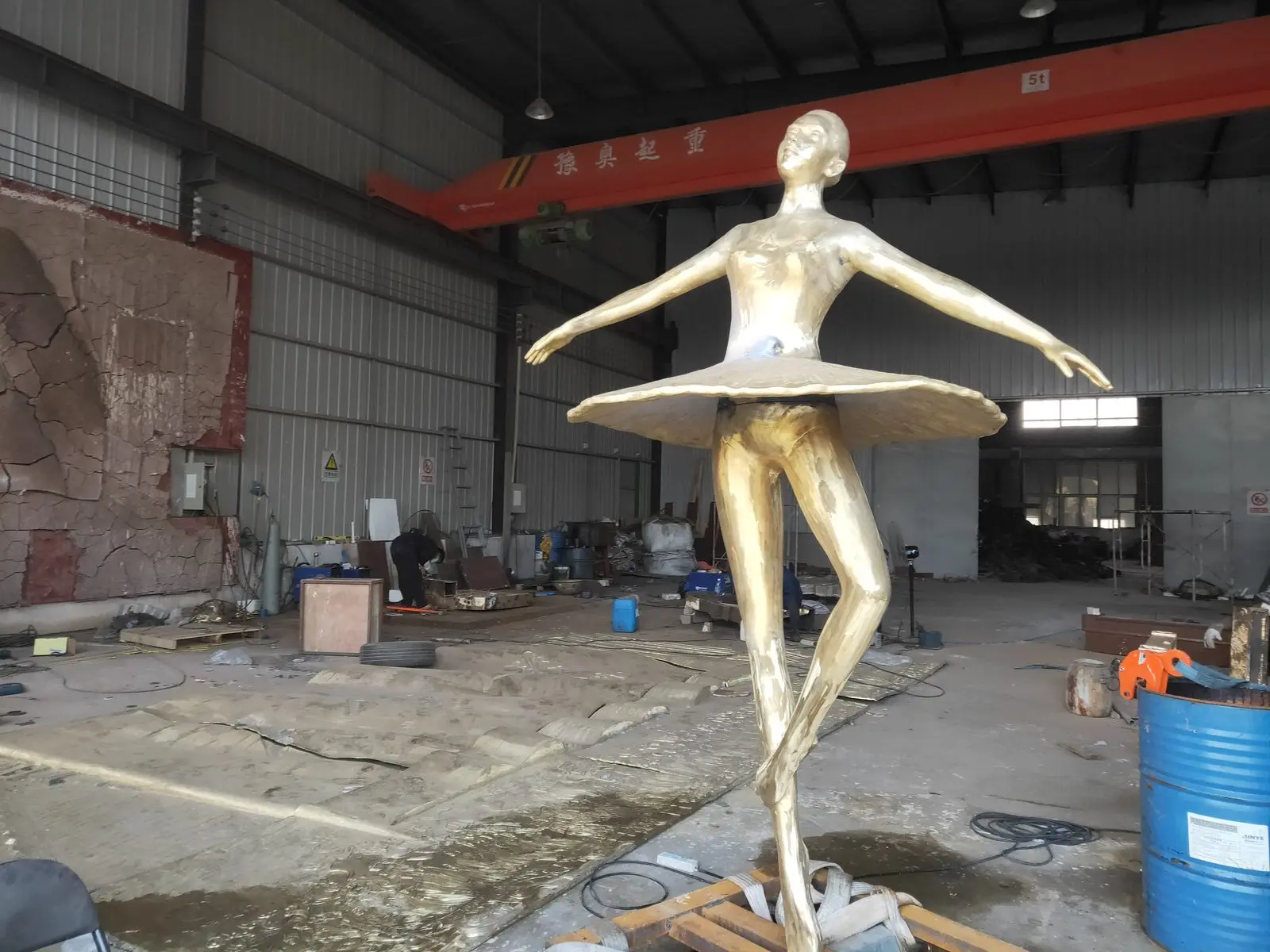 Gold patina ballet dancer sculpture in our foundry