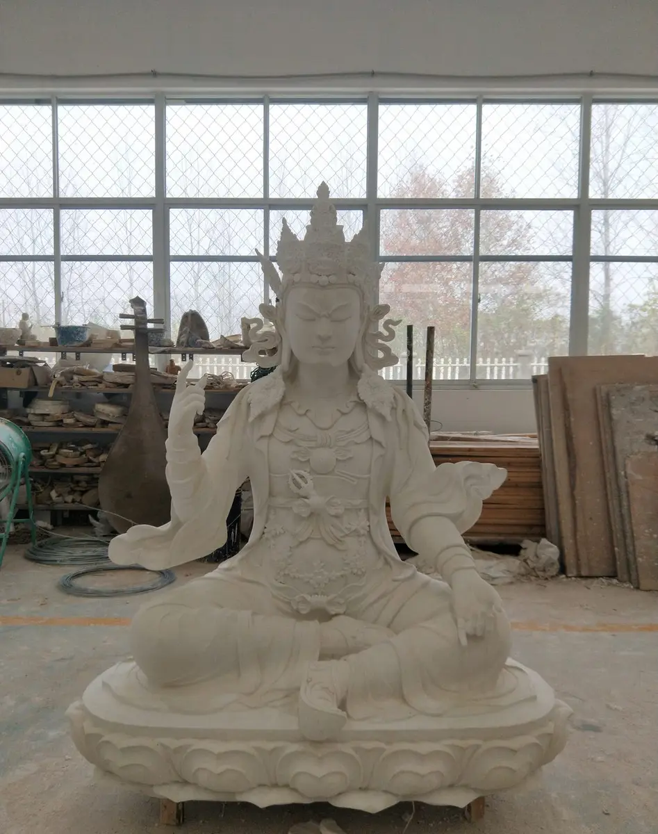 White carved stone figure of Guanyin in the workshop